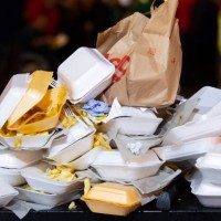 An overflowing bin full of takeaway food containers at night on March 16, 2019 in Cardiff, United Kingdom.