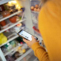 an unrecognizable woman is shopping for groceries online - food stock pictures, royalty-free photos & images