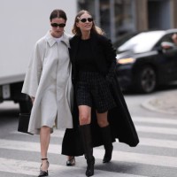 Annabel Rosendahl is seen wearing rectangular sunglasses with Havana frame, small silver hoop earrings, a fine silver necklace, a knee-length...