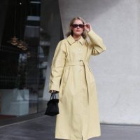 Annie Wheatland-Clinch is seen wearing a pastel yellow leather trench coat outside the Roksanda show during London Fashion Week February 2025 on...