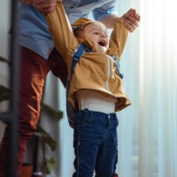 anonymous dad getting his daughter ready to go outside - junk food stock pictures, royalty-free photos & images