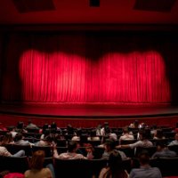 anxious audience waiting for the curtains to open to see the performance - concert stock pictures, royalty-free photos & images