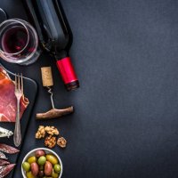 appetizer frame: red wine, iberico ham and cheese on rustic table - food stock pictures, royalty-free photos & images