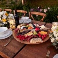 appetizer plate amidst crockery on table for dinner - garden decoration stockfoto's en -beelden