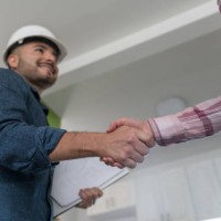 architect closing a deal with a customer about a remodeling project at home - home decoration stock pictures, royalty-free photos & images