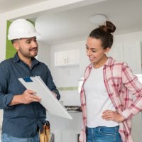architect talking to a woman about remodeling her house - home decoration stock pictures, royalty-free photos & images