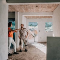 architects talking at house construction - home decoration stock pictures, royalty-free photos & images