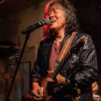 asean senior man performs hot live stage with electric guitar and vocal - concert stock pictures, royalty-free photos & images