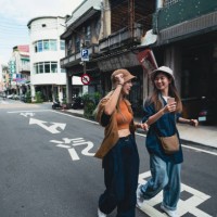 asia, two young women walk relaxed on the street in taiwan. - fashion stock pictures, royalty-free photos & images
