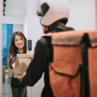 asian chinese delivery man with helmet press door bell for grocery food delivery - junk food stock pictures, royalty-free photos & images