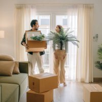 asian couple moving in new house. - home decoration stock pictures, royalty-free photos & images