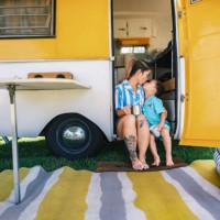 asian mother and son enjoying trailer camping outdoors - fashion stock pictures, royalty-free photos & images