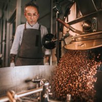 asian senior man craftsperson observing freshly roasted coffee beans being removed from the roaster into the cooling cylinder with motion blur - coffee stock pictures, royalty-free photos & images