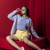 asian woman fashion sitting studio shot - fashion stock-fotos und bilder