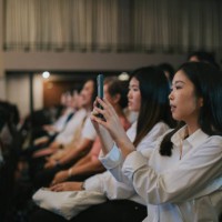 asian young adult filming with smart phone at concert - concert stock pictures, royalty-free photos & images