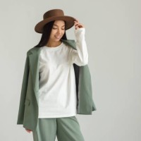 asian young model posing in beautiful brand clothes on a white background on a cyclorama - fashion stock pictures, royalty-free photos & images