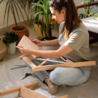 assembling a wooden piece of furniture - home decoration stock pictures, royalty-free photos & images