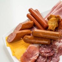 assorted cold cuts, sausages and cheese on plate - junk food stock pictures, royalty-free photos & images