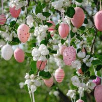 assorted pastel pink easter eggs hanging on blossoming apple tree - garden decoration stock pictures, royalty-free photos & images