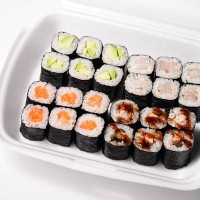 assorted sushi rolls in a takeaway box for delicious meal - junk food stock pictures, royalty-free photos & images