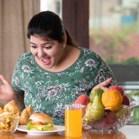 astonished woman looking at unhealthy food - junk food stock pictures, royalty-free photos & images
