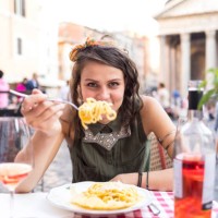 attractive young woman having meal in rome - food stock pictures, royalty-free photos & images