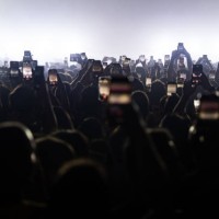 Audience addends Annalisa's concert filming the scene with their smartphone on April 13, 2024 in Naples, Italy.