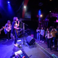 audience dancing to live band performing on stage at small venue - concert stock pictures, royalty-free photos & images