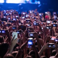 Audience with cell phones record the Now United concert at Espaco das Americas on November 20, 2019 in Sao Paulo, Brazil.