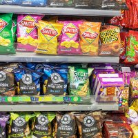 Australia, Victoria Melbourne Central Business District CBD Flinders Street pharmacy drugstore sale shelves convenience store junk food potato chips...