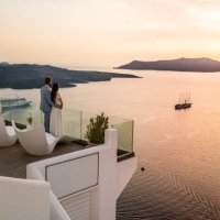 authentic wealth - rich couple standing on terrace with amazing sea view - travel stock pictures, royalty-free photos & images