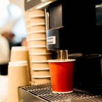 automatic coffee machine in a self-service restaurant, preparing various types of coffee hot drinks. red paper disposable coffee cups to go. fast food cafeteria - junk food stock pictures, royalty-free photos & images