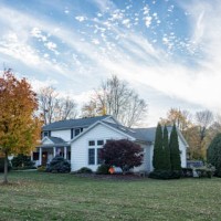 autumn maple leaf color and suburban colonial house - garden decoration stock pictures, royalty-free photos & images