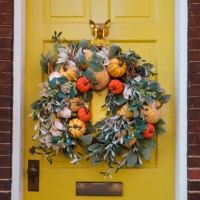 autumn wreath adorns yellow front door - home decoration stock pictures, royalty-free photos & images