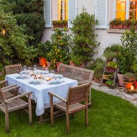 autumnal laid table in garden in the evening - garden decoration stock pictures, royalty-free photos & images