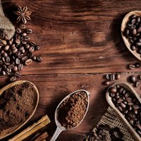 background of coffee beans and grinded coffee on a rustic table - coffee stock pictures, royalty-free photos & images