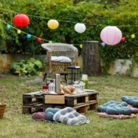 backyard garden party setting is complete with beautiful decorations, food and drink, and outdoor seating - garden decoration stock pictures, royalty-free photos & images