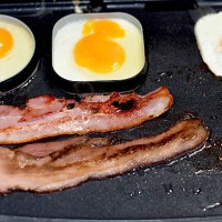 bacon and eggs on griddle - junk food stock pictures, royalty-free photos & images