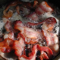 bacon sizzlin' at camp - junk food stock pictures, royalty-free photos & images
