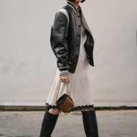Bae Doona wears a black and white leather teddy jacket, a white knee long dress with lace borders, a brown monogram leather LV bag, knee high leather...