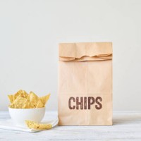 bag of tortilla nacho chips in a bowl - junk food stock pictures, royalty-free photos & images