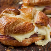 baked ham and brie croissant sandwiches with dijon mustard - junk food stock pictures, royalty-free photos & images