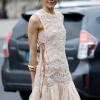 Bambi Northwood-Blyth wears beige maxi dress with decorated top part and tulle skirt, gold bracelet, outside Zimmermann, during the Womenswear...