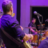 band of four musicians and singer playing on stage - concert stock pictures, royalty-free photos & images
