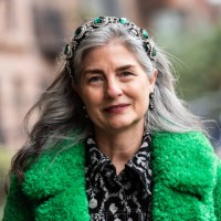 Barbara Paris Guilford wears Anna Sui green fluffy coat and black and grey shirt dress outside Anna Sui during February 2025 New York Fashion Week on...