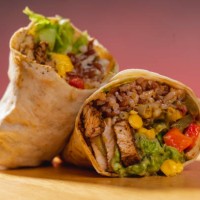 barbecue chicken, corn and guacamole tortilla wraps on a wooden base. vegetable burrito. healthy food. - junk food stock pictures, royalty-free photos & images