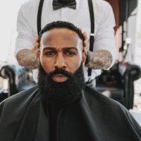 barber cutting hair in barber shop - hairstyle stock-fotos und bilder