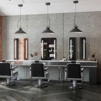 barber shop with mirrors, chairs, pendant lights and brick wall - home decoration stock pictures, royalty-free photos & images