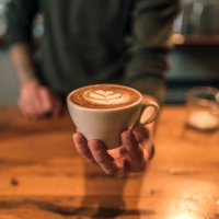 barista holding a cup of espresso coffee - coffee stock pictures, royalty-free photos & images