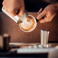 barista making a latte milk coffee with milk froth - coffee stock pictures, royalty-free photos & images
